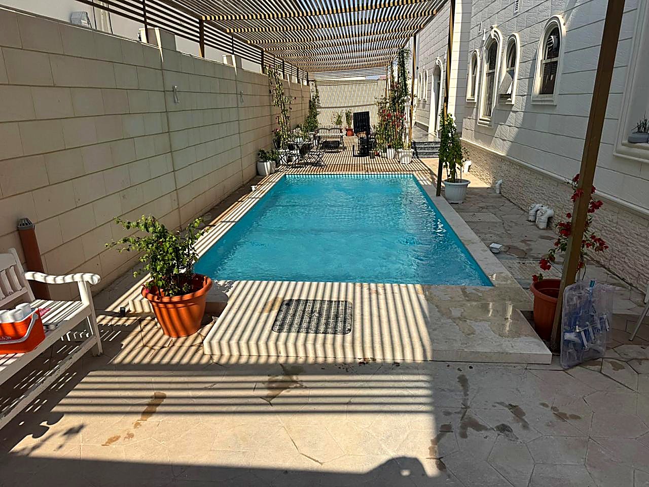 Pergola-covered lap pool